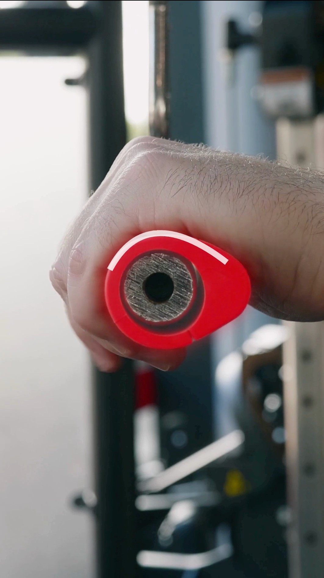 Side view of the PUMPZ curved side gripped on a cable handle for pressing